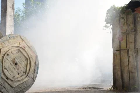Smoke grenade explosion on polygon during lasertag or paintball game Stock Photos
