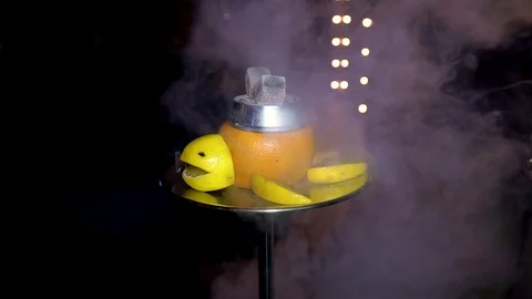 Smoke a hookah on the fruit Stock Footage 99958047