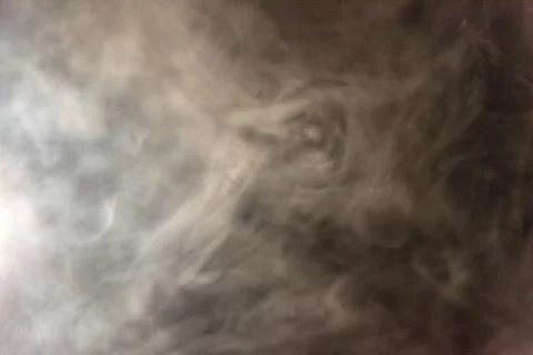Smoke image in a black background Stock Photos
