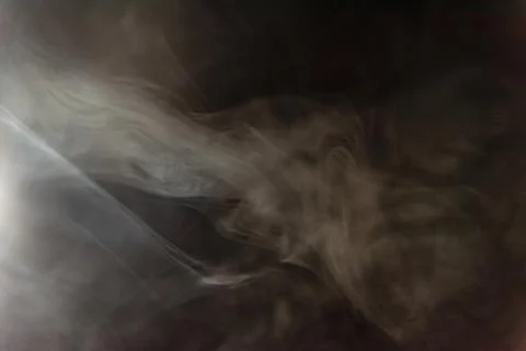 Smoke image in a black background Stock Photos