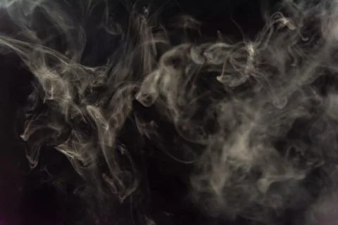 Smoke image in a black background Stock Photos