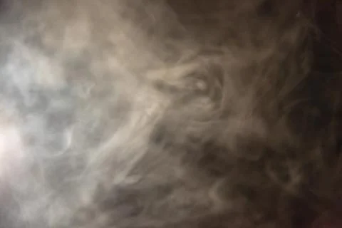 Smoke image in a black background Stock Photos