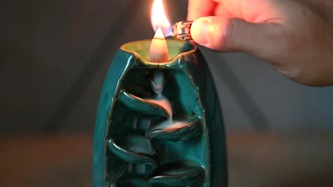 Smoke from incense creates a waterfall effect Stock Footage 164577350