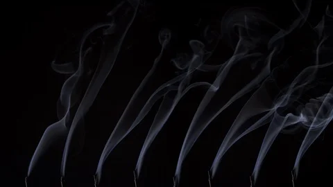 Smoke from Incense Sticks Burning in a Row 库存影片 125398564