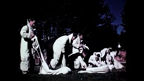 The smoke jumpers uniform is adjusted for optimal fit, and then parachute Stock Footage 107738053