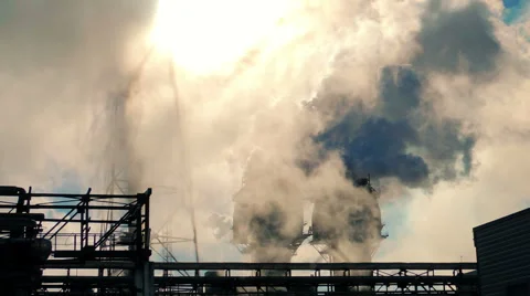 Smoke from large pipes at dawn, the glare of the sun (5) Video stock 48631953