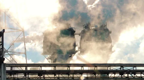 Smoke from large pipes at dawn, the glare of the sun (9) Video stock 48632004