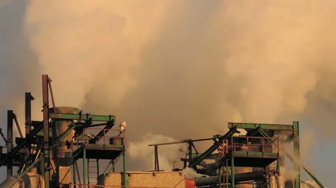 Smoke from large pipes at sunset (11) Video stock 48632547
