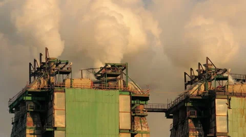 Smoke from large pipes at sunset (9) Stockbeeldmateriaal 48632534