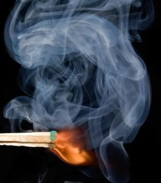 Smoke from a lighted match Stock Photos