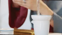 Pouring hot boiling water into cup or mu, Stock Video