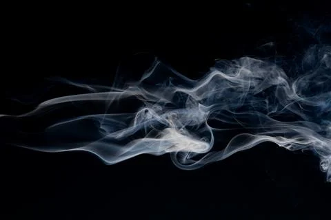 Smoke pattern on black background. Smoke wisps and white vapor. Transparent.. 库存照片