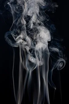 Smoke pattern on black background. Smoke wisps and white vapor. Transparent s Stock Photos