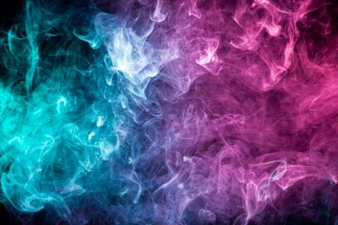 Smoke of pattern pink and blue   on a dark isolated background.  Scary and my Stock Photos