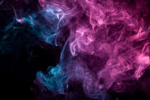 Smoke of pattern pink and blue   on a dark isolated background.  Scary and my Stock Photos
