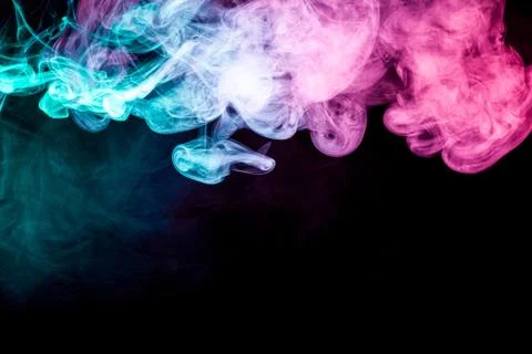 Smoke of pattern pink and blue   on a dark isolated background.  Scary and my Fotos de archivo