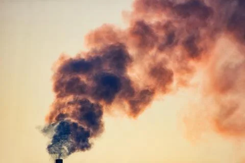 Smoke from a pipe against the sky Stock Photos