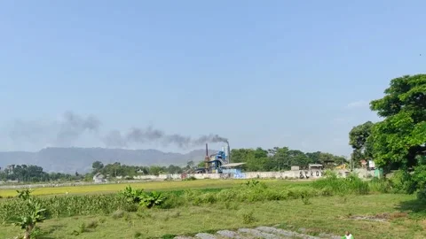 Smoke polluting the air from a factory in Java, Indonesia. Stock Footage 248483627