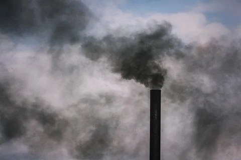 Smoke pollution from palm oil processing factories. the concept of air pollut Stock Photos