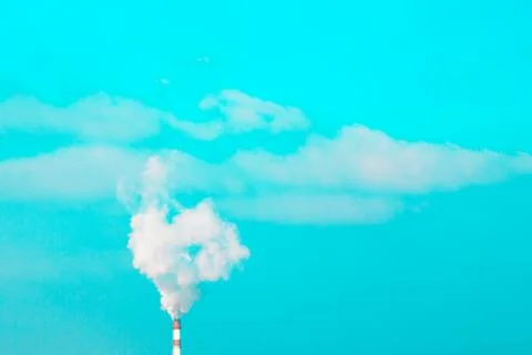 Smoke polution at blue sky Stock Photos