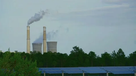 Smoke pouring out of a Electrical power generating facility Stock Footage 64342014
