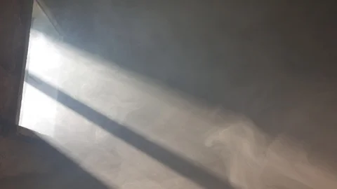 Smoke in the rays of light from the window. Room. Stock Footage 116015570