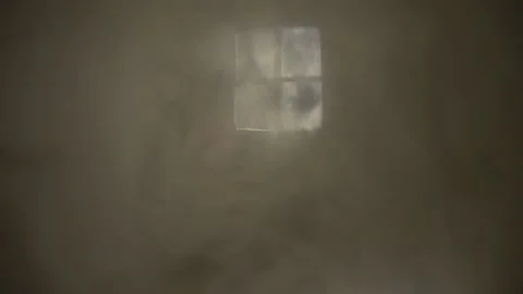 Smoke in the rays of light from the window. Room. Stock Footage 145886943