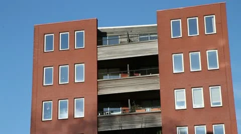 Smoke reflected on the windows of a red brick building Stock-Footage 20443353