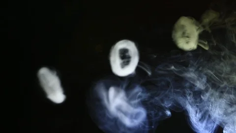 Smoke Rings Over Dark Background Created by Vaping e-Cigarette Stock Footage 100621172