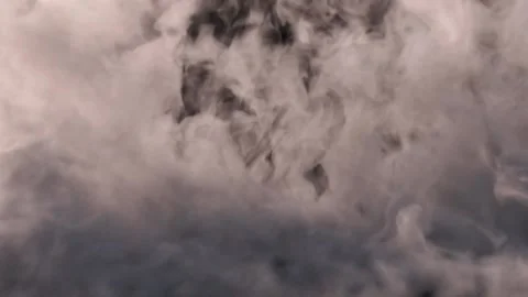 Smoke rises from bottom to top against a black background in a solid mass. Wall Stock Footage 168596409