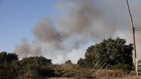 Smoke rises from brush fire Stock Footage 114413536