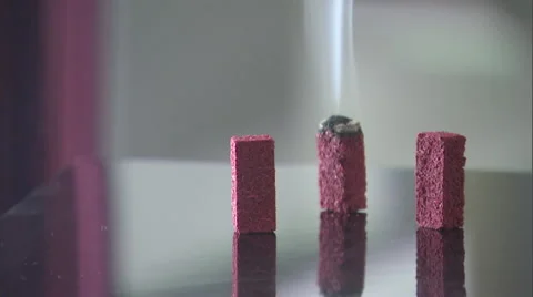 Smoke rises from burning incense cones. Stock Footage 46869596