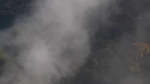 Smoke Rises From A Forest In The Mountain Stock Footage 102552378