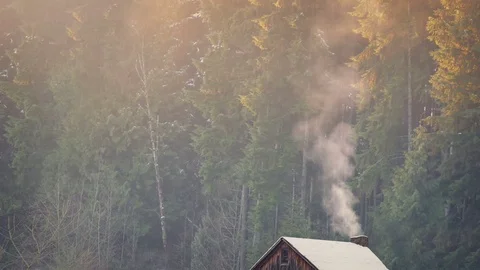 Smoke Rises From Log Cabin In Winter Stock Footage