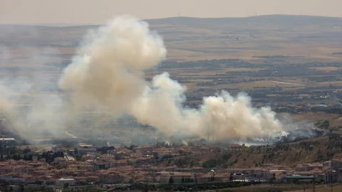 Smoke rises over city mosque after bombing and fire - Blast Damage and War Zone Stock Footage 339738033