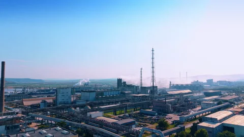 Smoke rises over the territory of a large industrial plant. Footage over the Stock Footage 340360395