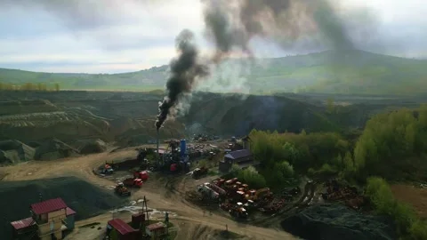 Smoke rises thickly from a mining operation Stock Footage 331620020