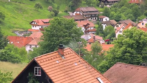 Smoke rising from the chimney, small mountain village, Black Forest. Stock Footage 132184400
