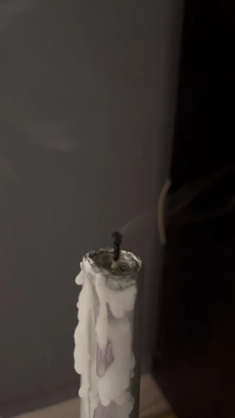Smoke Rising from Extinguished White Candle with Melted Wax Stock Footage 345306757