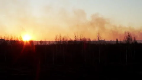 Smoke in the sky against the sunset after the city was shelled by artillery. War Video stock 314429107