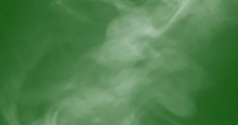Smoke slowly floating through space against chroma key green screen Stock Footage 294765828