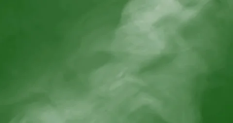 Smoke slowly floating through space against chroma key green screen Stockbeeldmateriaal 327655592