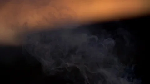 Smoke from small campfire at sunset 스톡 동영상 102905689