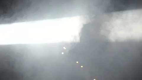 Smoke in soffit spotlights beam on the open air disco party Vídeo Stock 100027761