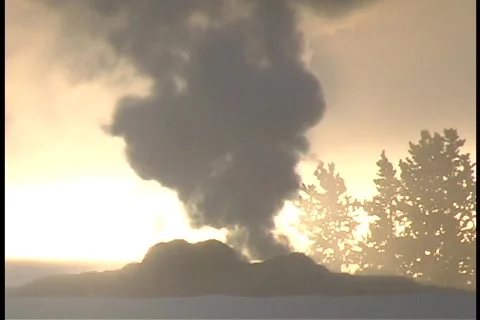 Smoke spews from a geothermal feature in Yellowstone National Park. Stock Footage