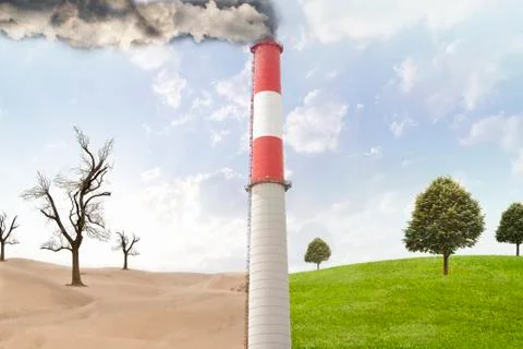 Smoke stack between desert and rural field 스톡 사진