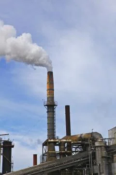 Smoke stack blue sky vertical Stock Photos