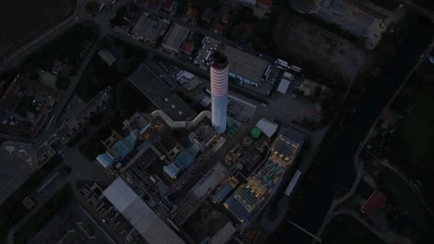 Smoke stack chimney of large industrial waste to energy facility in North Stock Footage 320597567