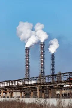Smoke stack of coal power plant on blue sky background. Smoke stack of coa... 스톡 사진