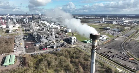 Smoke stack at a large refinery in Moerdijk, The Netherlands. Smoking chimney Stock Footage 264531174